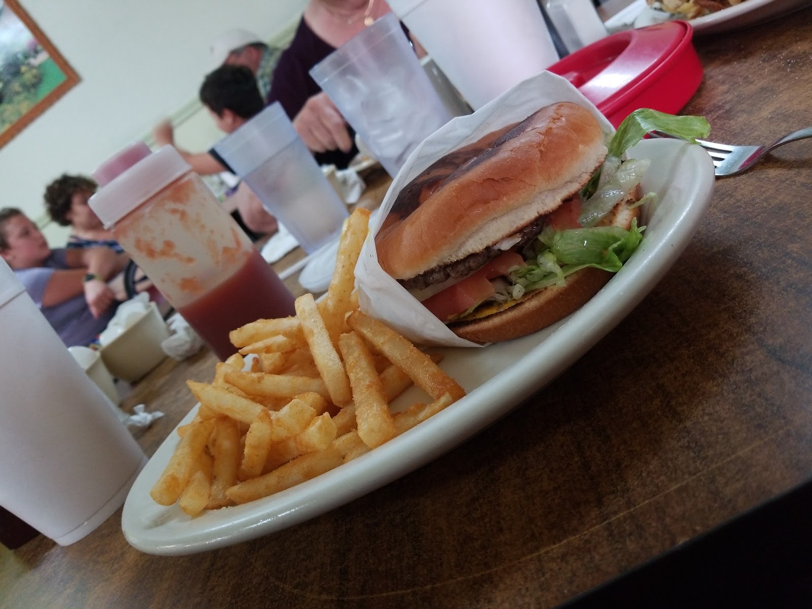 Burger and fries plate served in the dining room