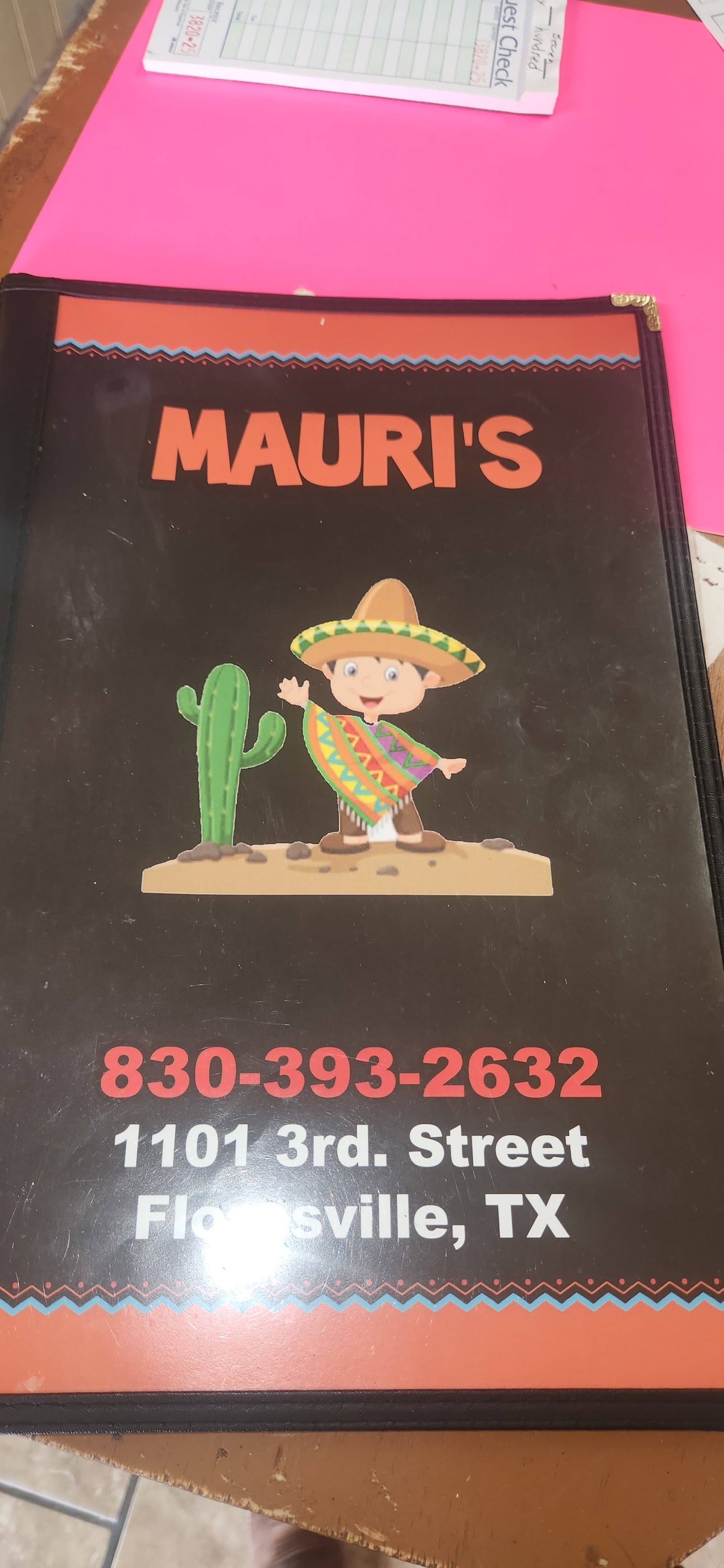 Mauri's menu cover with a hand-painted cactus design